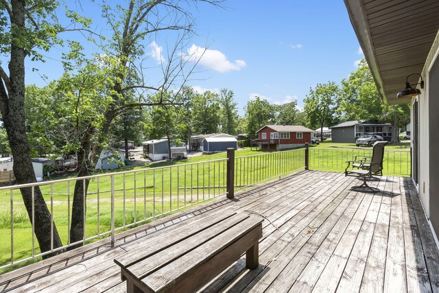 9 View Table Rock Lndg Unit 12, Branson West, MO 65737 - wooden deck featuring a lawn