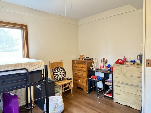 bedroom with wood finished floors