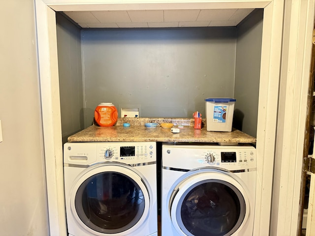 laundry area featuring laundry area and washing machine and dryer