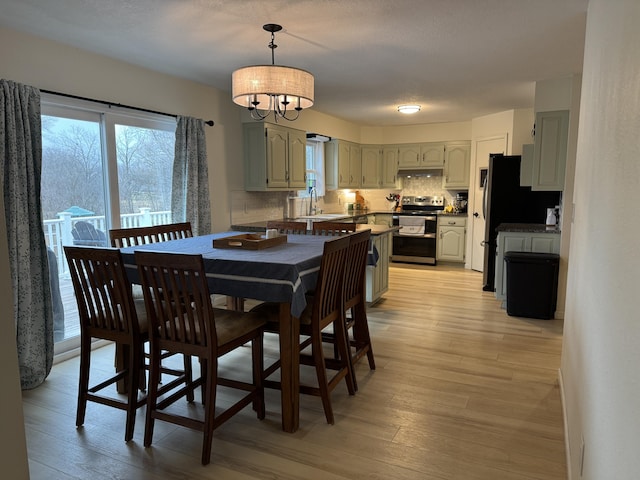 dining space with light wood-style floors