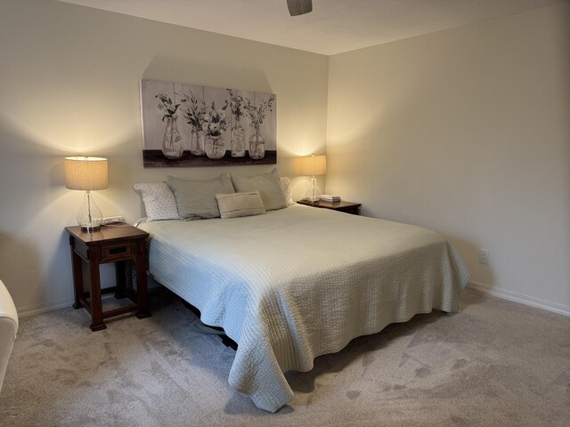 carpeted bedroom featuring baseboards