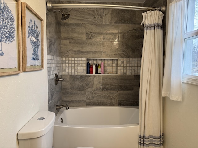 bathroom with shower / tub combo and toilet