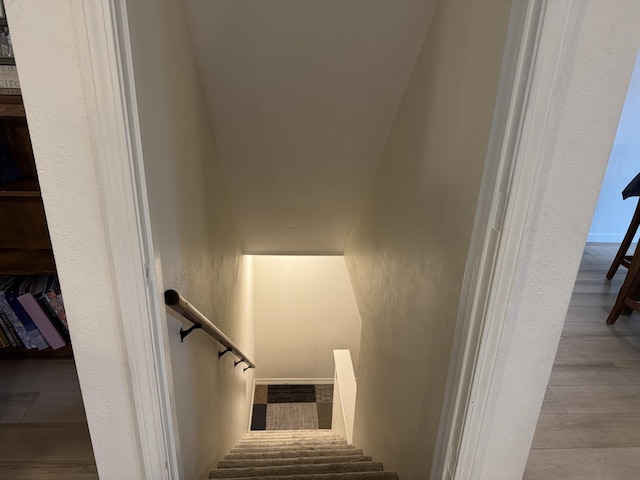 stairs with wood finished floors