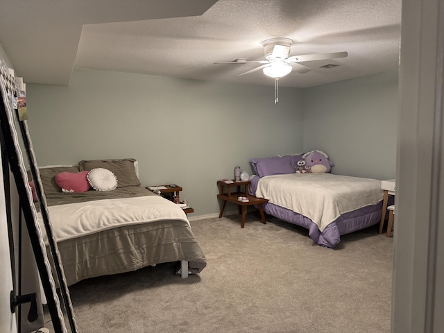 bedroom featuring visible vents, light colored carpet, ceiling fan, a textured ceiling, and baseboards