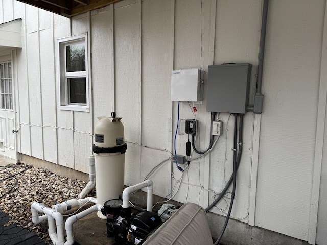 exterior details featuring pump and board and batten siding