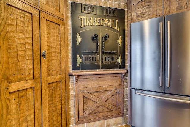 kitchen featuring freestanding refrigerator