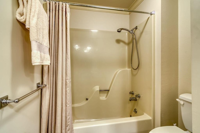 bathroom featuring toilet and shower / tub combo with curtain