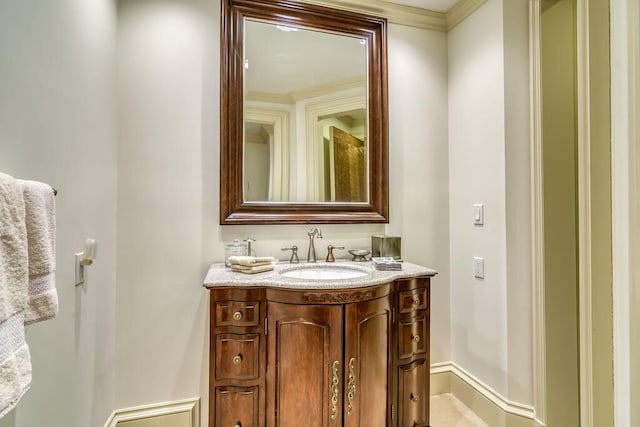 bathroom featuring baseboards and vanity