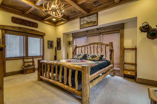 bedroom with carpet, coffered ceiling, a notable chandelier, and baseboards