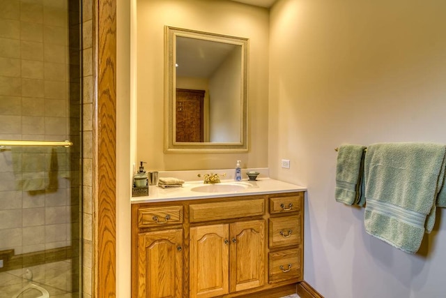 full bathroom featuring a shower stall and vanity