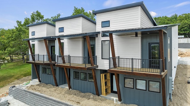 exterior space with metal roof and board and batten siding