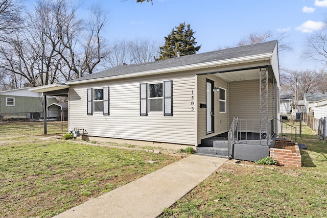 bungalow featuring a front lawn, a porch, and fence