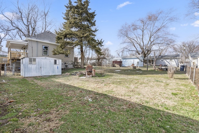 view of yard with a carport and fence