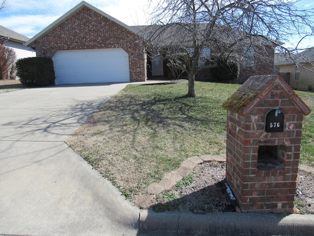 ranch-style home with concrete driveway, brick siding, an attached garage, and a front yard