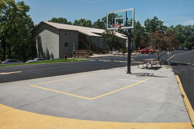 uncovered parking lot featuring community basketball court