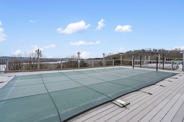 view of swimming pool featuring fence and a fenced in pool