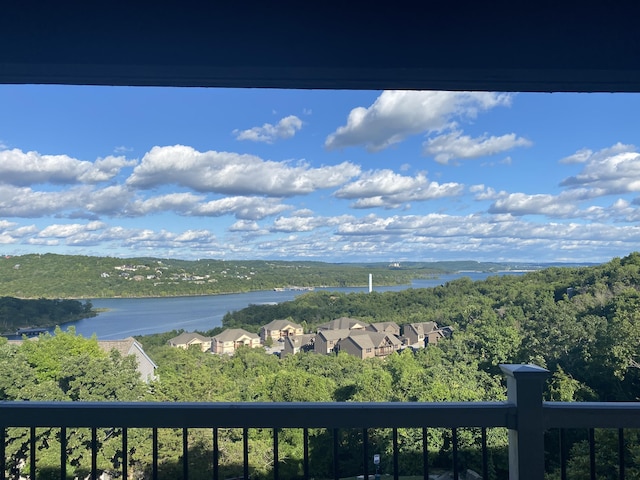 property view of water featuring a forest view