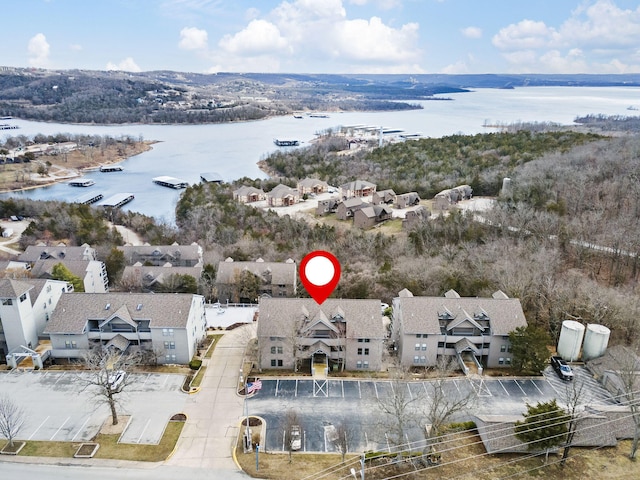 birds eye view of property featuring a residential view and a water view