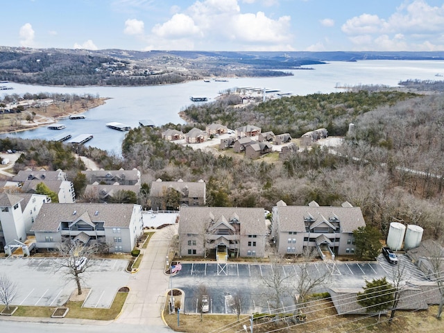 drone / aerial view with a residential view and a water view