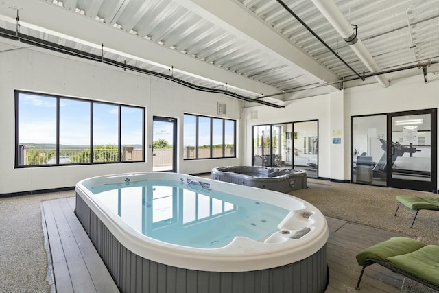 view of pool featuring an indoor hot tub