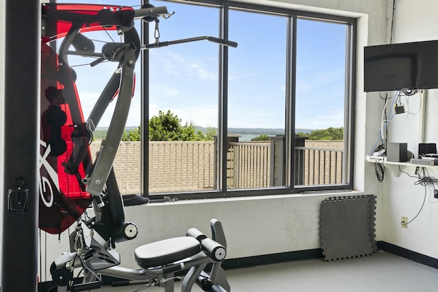 exercise room with baseboards