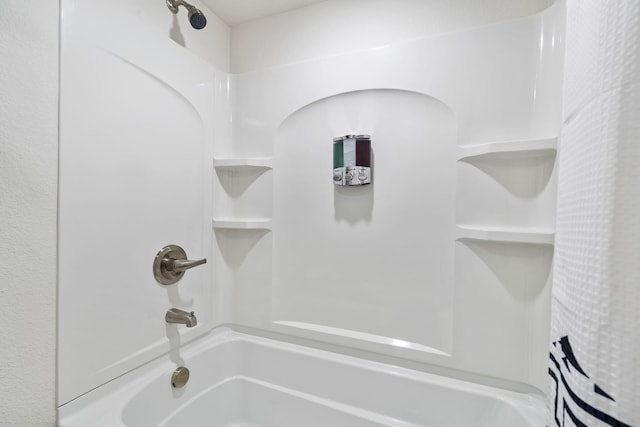 bathroom with shower / bathtub combination with curtain