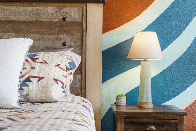 bedroom featuring a textured wall