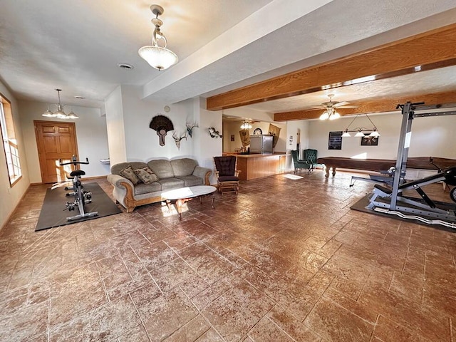 exercise room featuring visible vents and ceiling fan