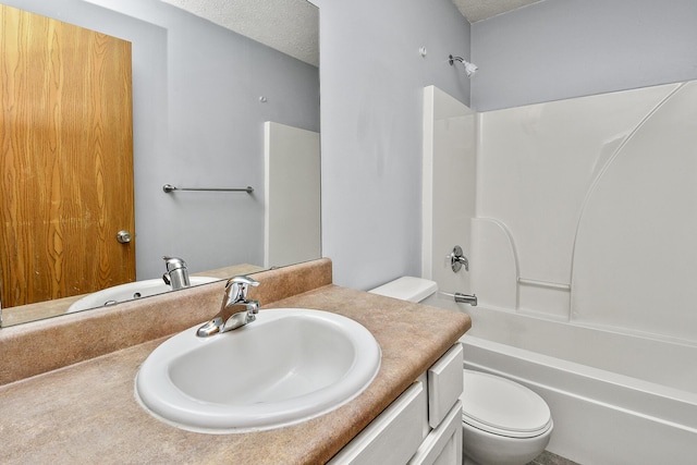 full bathroom featuring a textured ceiling, vanity, toilet, and shower / bathtub combination