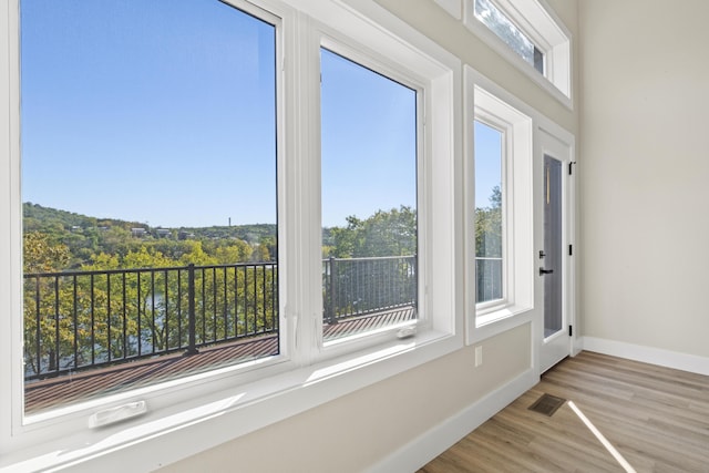 unfurnished sunroom with visible vents