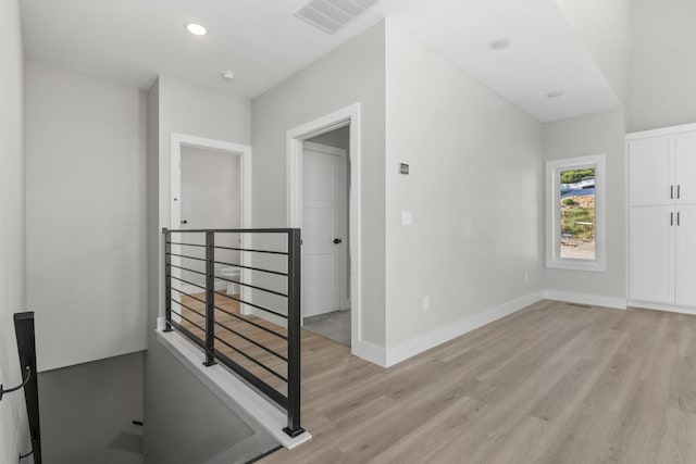 entryway with recessed lighting, light wood-type flooring, visible vents, and baseboards