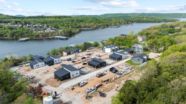 bird's eye view of a heavily wooded area and a nearby body of water