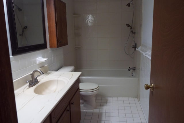 full bathroom with tile patterned flooring, toilet, vanity, shower / bathing tub combination, and tasteful backsplash