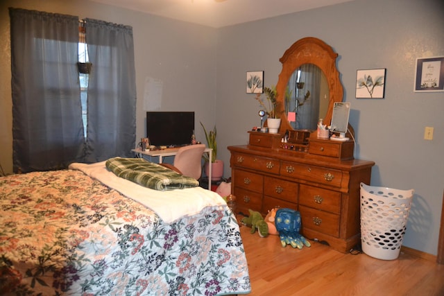 bedroom featuring wood finished floors