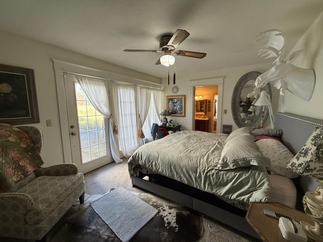 carpeted bedroom featuring access to outside, ceiling fan, and ensuite bathroom