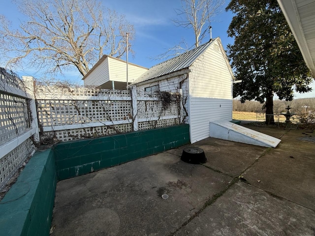 view of side of property with metal roof