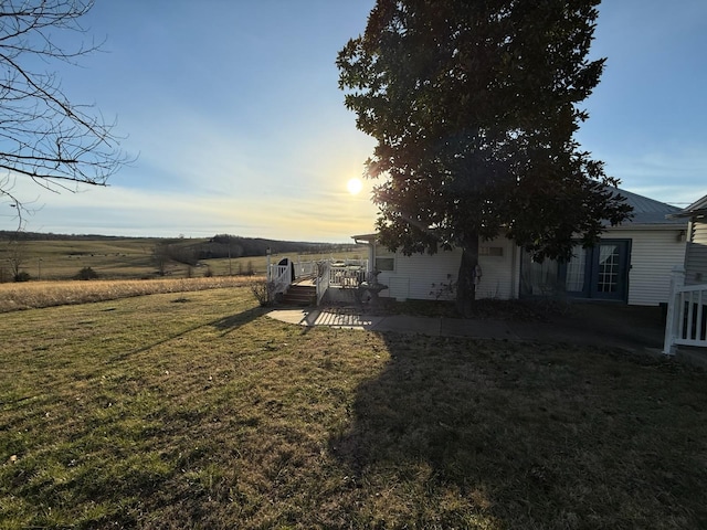 view of yard with a rural view