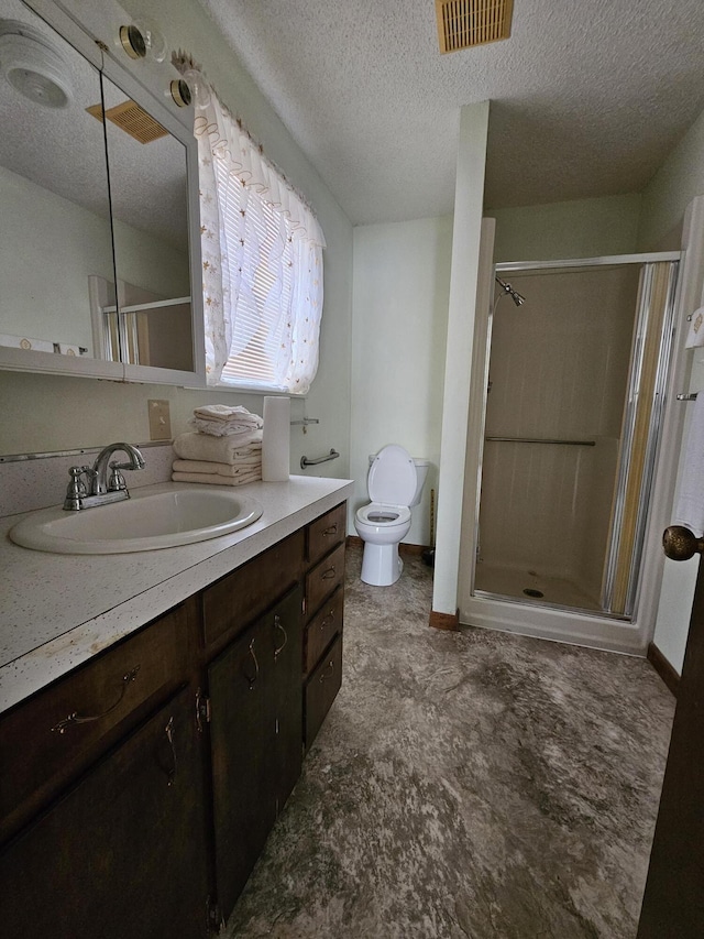 full bathroom with toilet, vanity, a shower stall, and visible vents