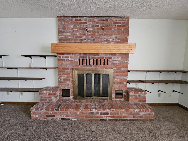 interior details with carpet floors, a brick fireplace, visible vents, and a textured ceiling