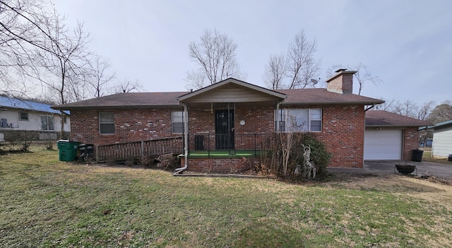 ranch-style house with a porch, a garage, brick siding, a front lawn, and a chimney