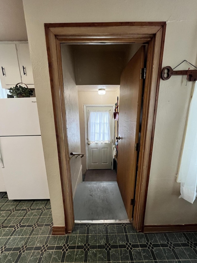 hall featuring tile patterned floors