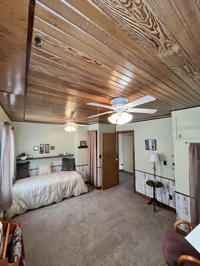 bedroom featuring carpet floors, wooden ceiling, and a ceiling fan