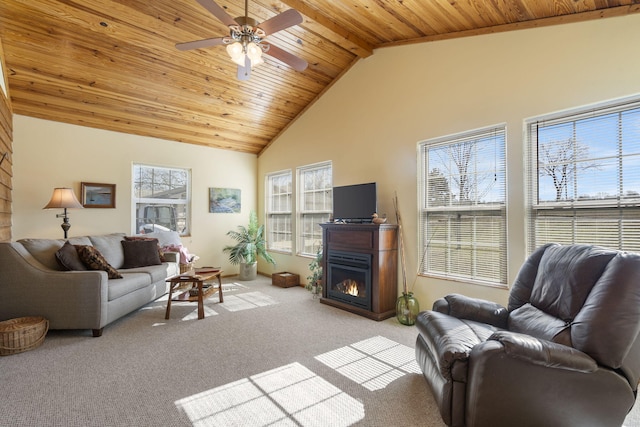 living area with wood ceiling, a lit fireplace, light carpet, and high vaulted ceiling