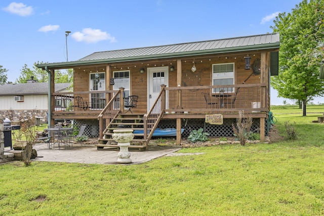 LOT19 Edwards Dr, Shell Knob, MO 65747 - view of front facade featuring a front yard, a porch, metal roof, and a patio
