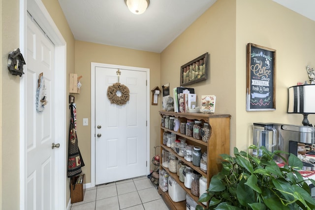 foyer featuring light tile patterned floors