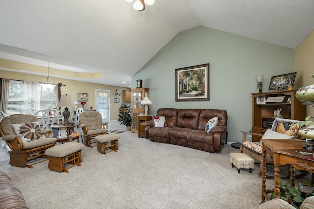 living room featuring carpet floors and high vaulted ceiling