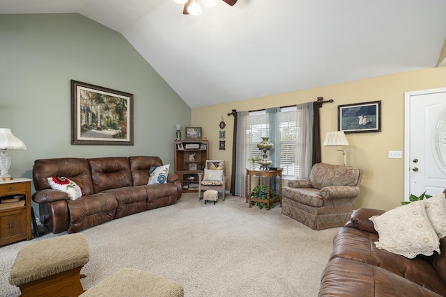 living area featuring vaulted ceiling, carpet floors, and ceiling fan