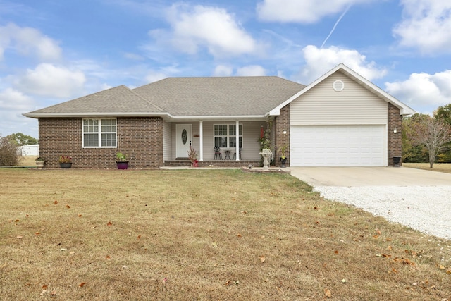 single story home featuring a porch, an attached garage, brick siding, concrete driveway, and a front lawn