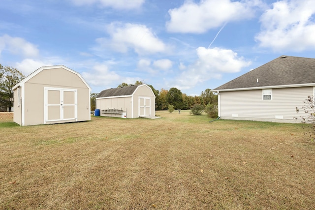 view of yard with an outdoor structure and a shed