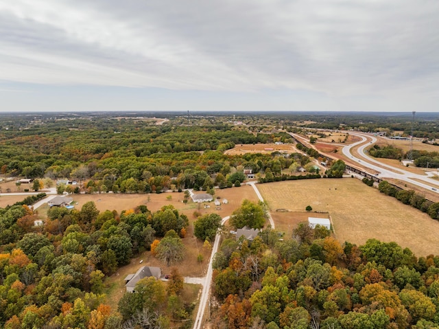 drone / aerial view featuring a view of trees